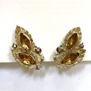 Vintage Lisner clip on earrings textured goldtone leaf shapes golden rhinestones